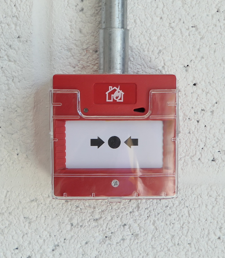 Image of our westcountry fire protection employees setting a fire alarm panel.